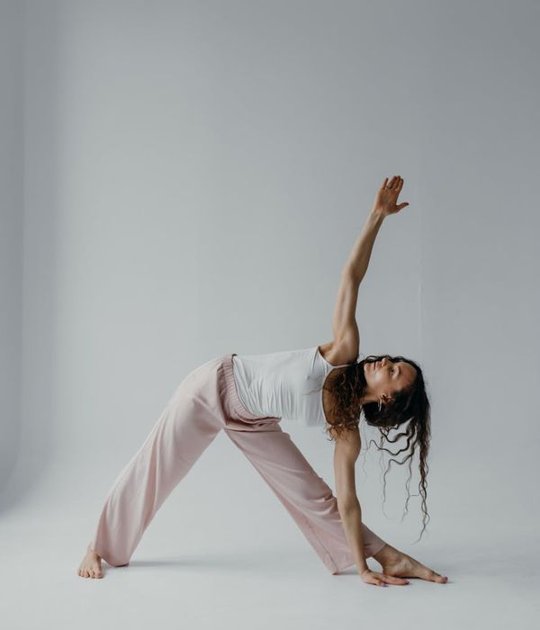 A woman in a calm yoga pose, embodying grace and inner balance.